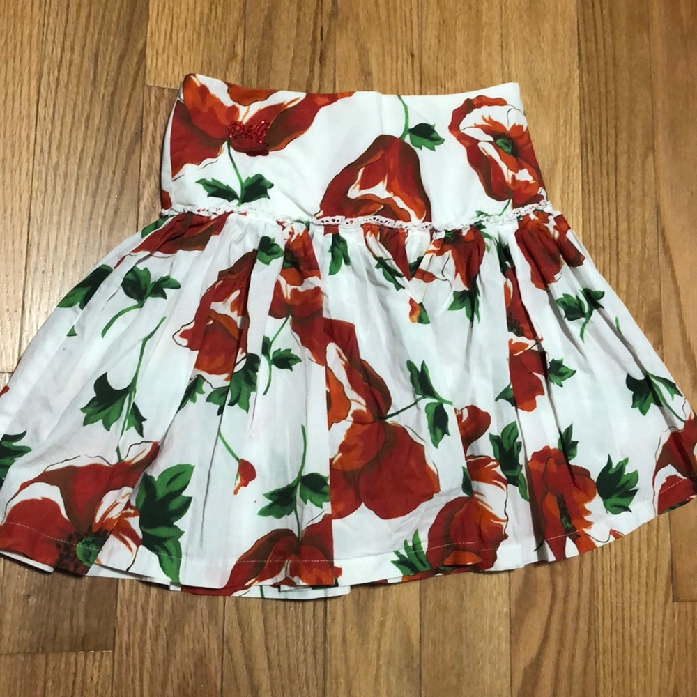 White skirt with red flowers
